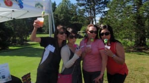 Golf tournament group of girls drinking juice