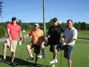 Four mens standing with golf stick