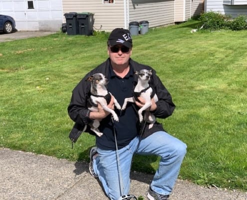 Man with two little dogs